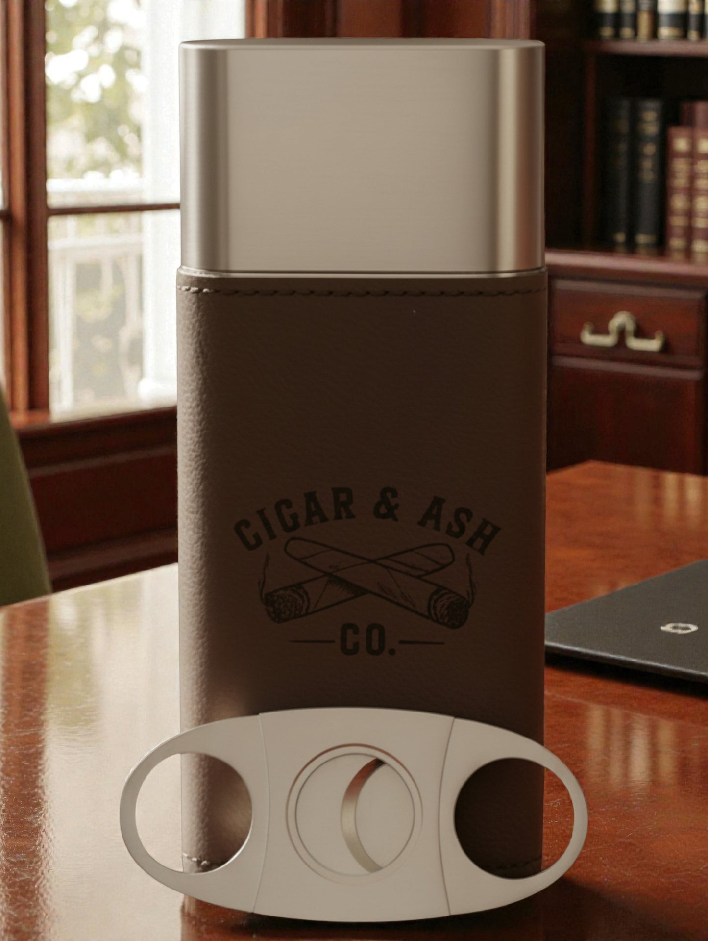 Brown leather Triple-Threat Cigar Case holding three cigars, designed for travel and protection.