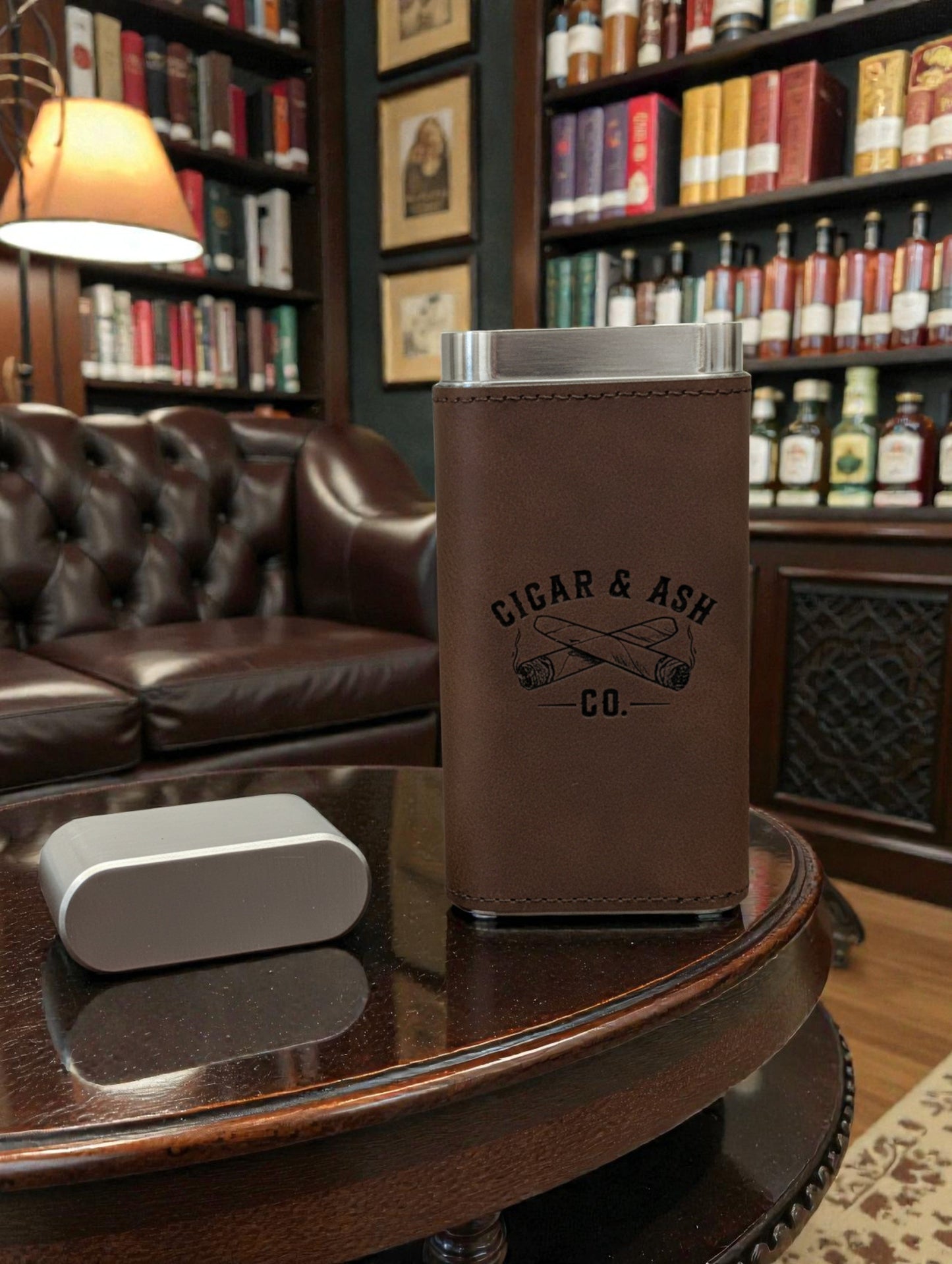 Brown leather Triple-Threat Cigar Case holding three cigars, designed for travel and protection.