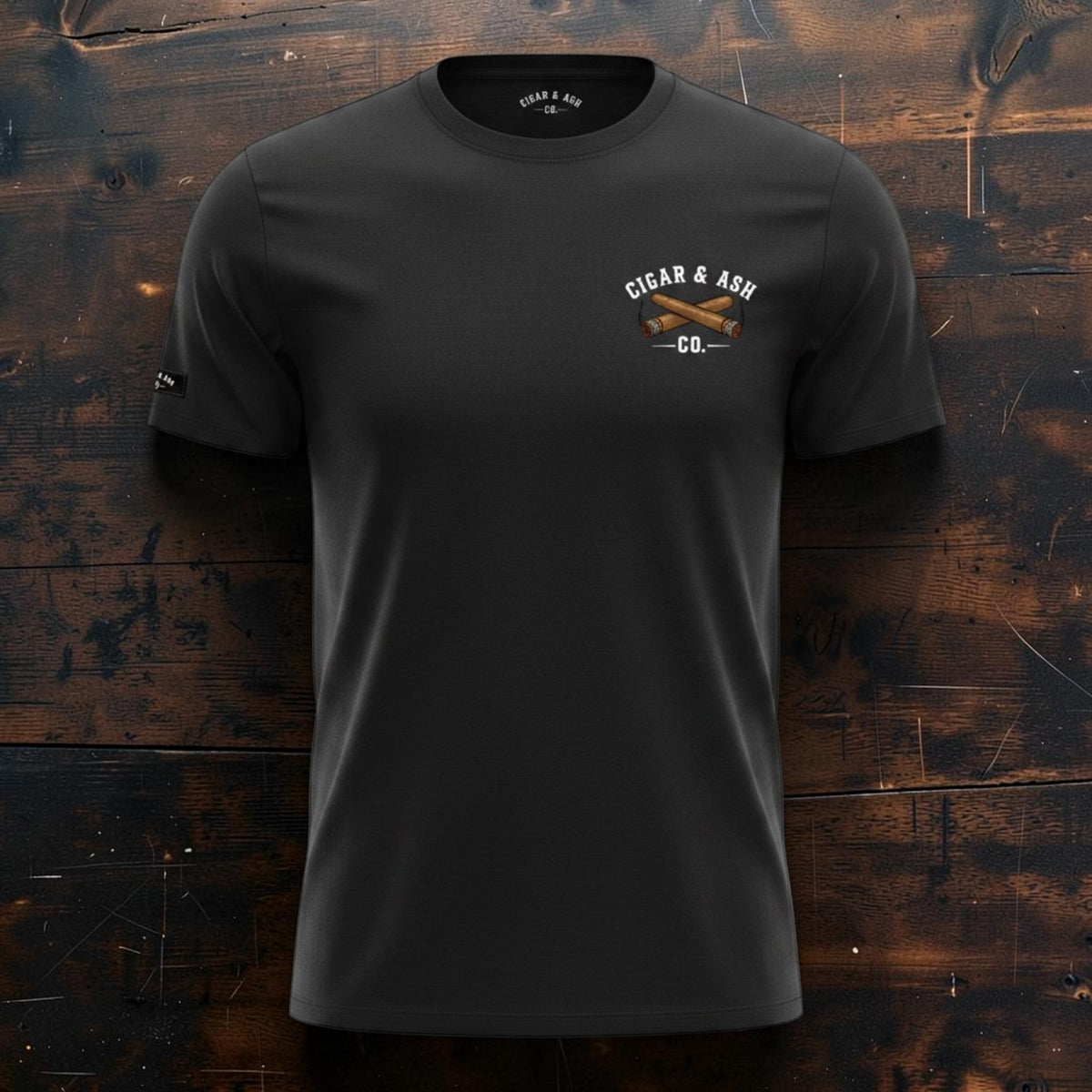 Front view of Cigar & Ash Co. The Classic Tee in black with embroidered left chest crossed cigars logo