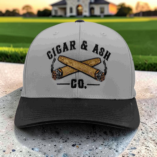 Front view of Cigar & Ash Co. two-tone grey and black laser perforated snapback hat with embroidered logo