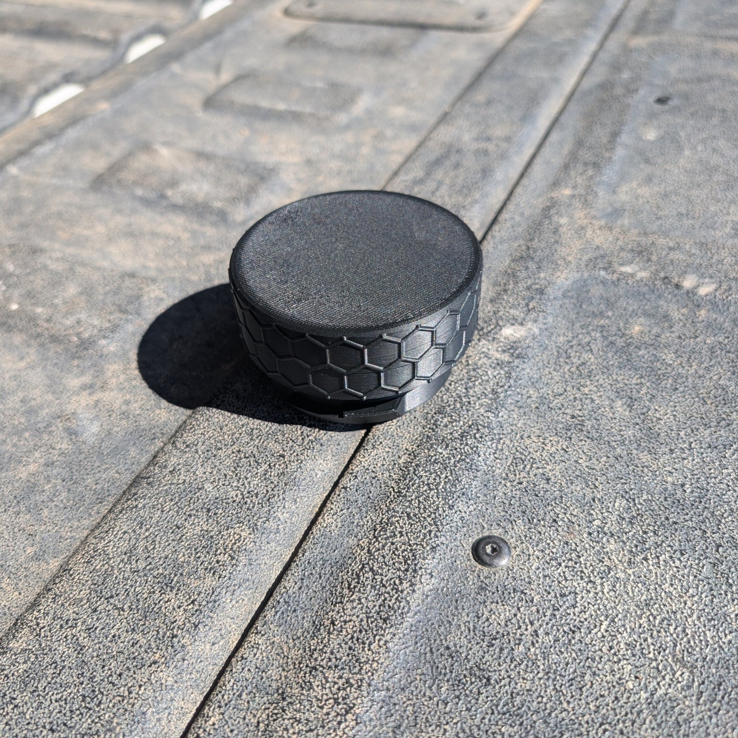 Closed custom pouch holder lid attachment with textured black honeycomb outer ring