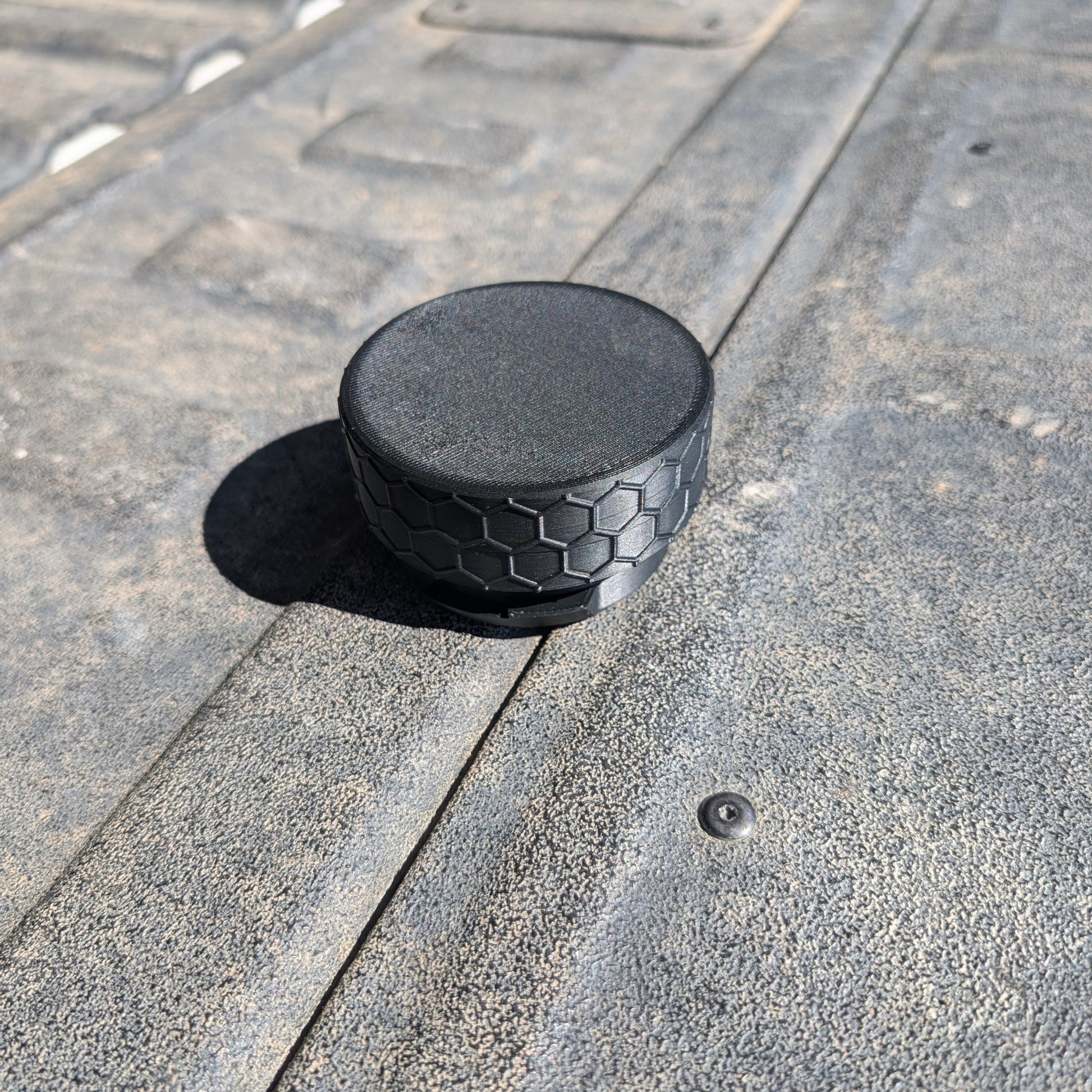 Closed custom pouch holder lid attachment with textured black honeycomb outer ring